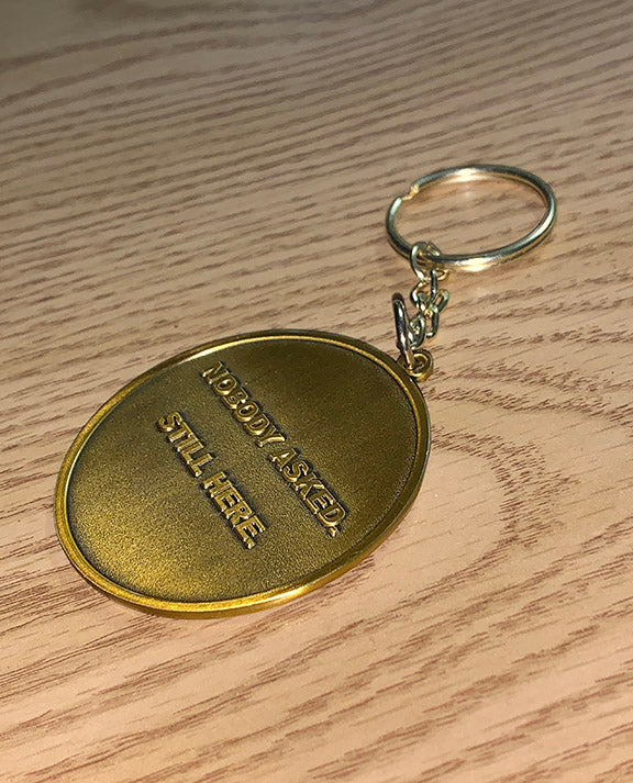 Nobody Asked. Still Here. Collector Keychain